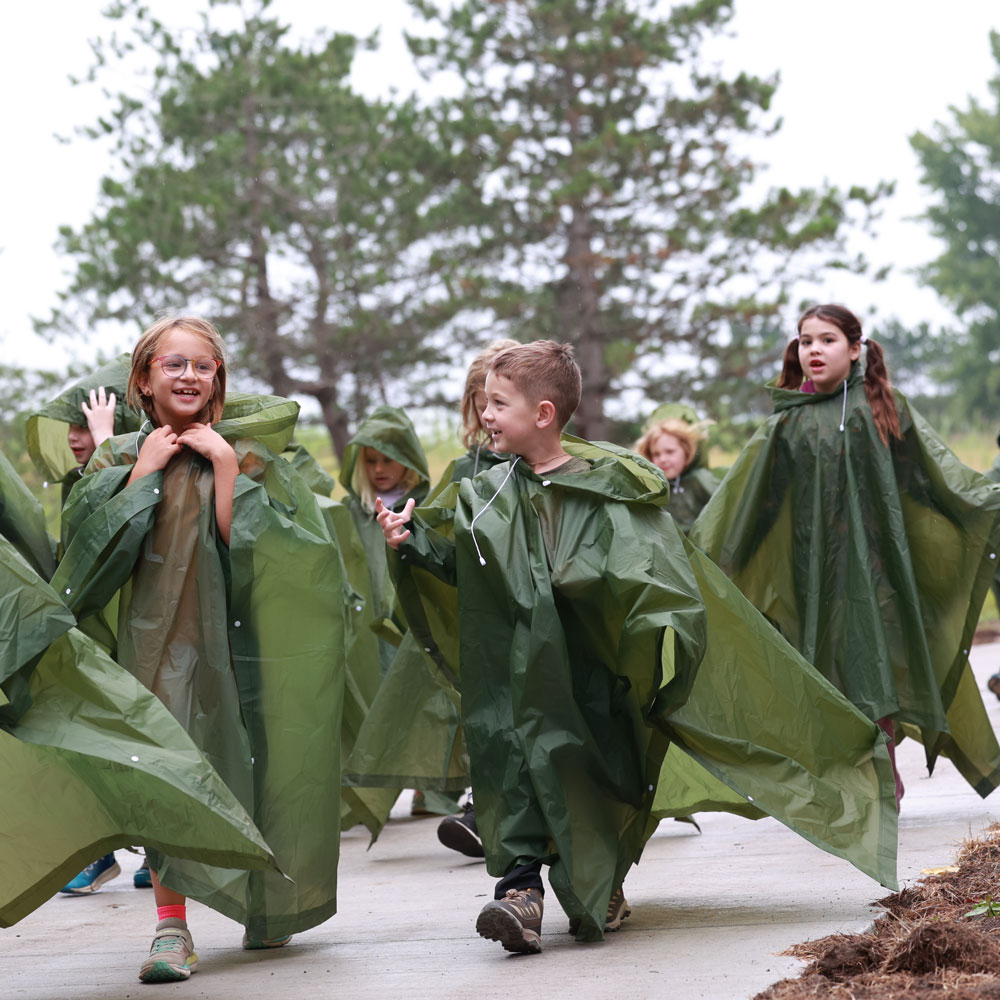 Group of kids in parkas on walk